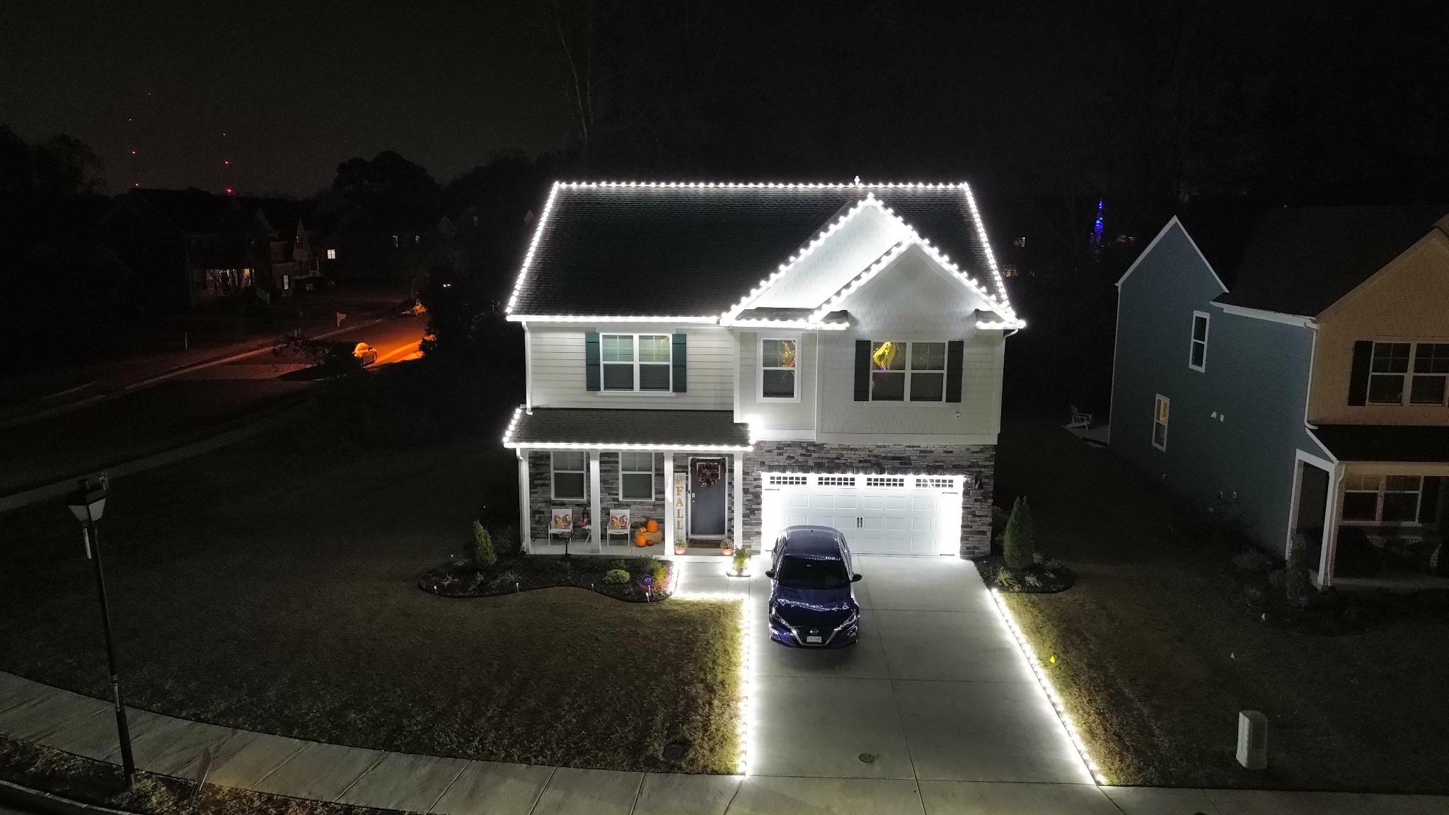 Drone view of professional roofline Christmas lights