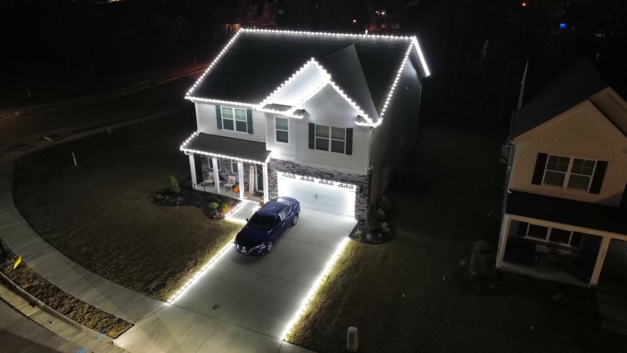 Professional Christmas lights around roofline and driveway